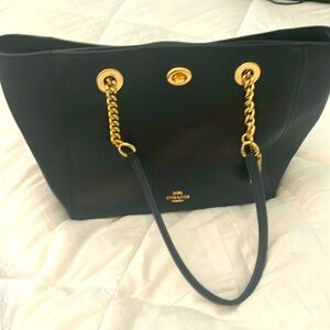 Black leather coach bag with gold hardware
